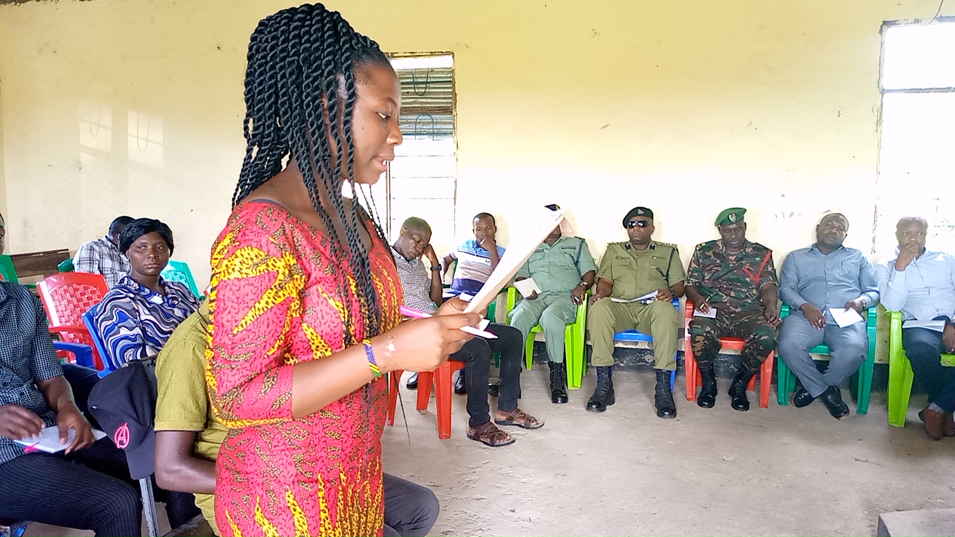 PETS Commitee representative (from Kibaoni Village) presenting PETS findings report in front of Mlele District Commissioner and Mlele District Defence & Security Committee